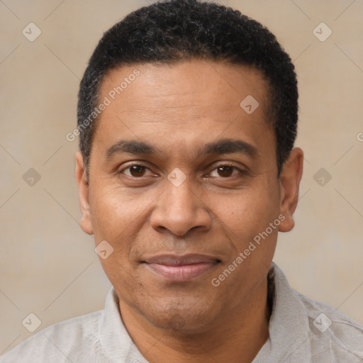 Joyful latino adult male with short  black hair and brown eyes