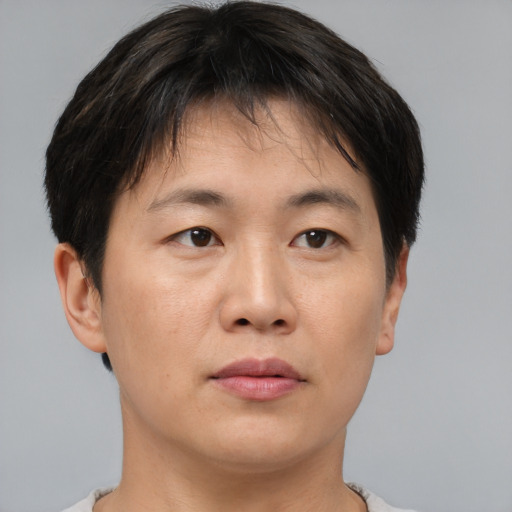Neutral asian young-adult female with short  brown hair and brown eyes