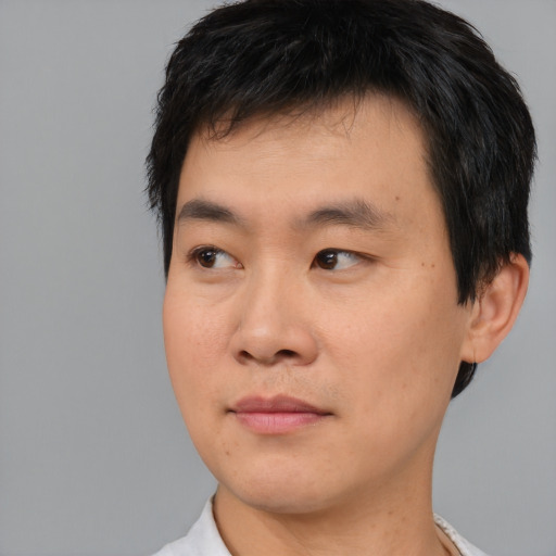 Neutral asian young-adult male with short  black hair and brown eyes