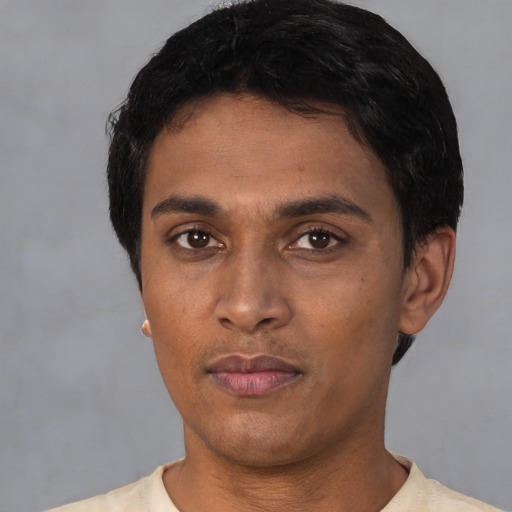 Neutral latino young-adult male with short  black hair and brown eyes