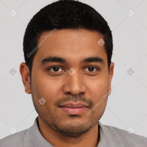 Joyful latino young-adult male with short  black hair and brown eyes