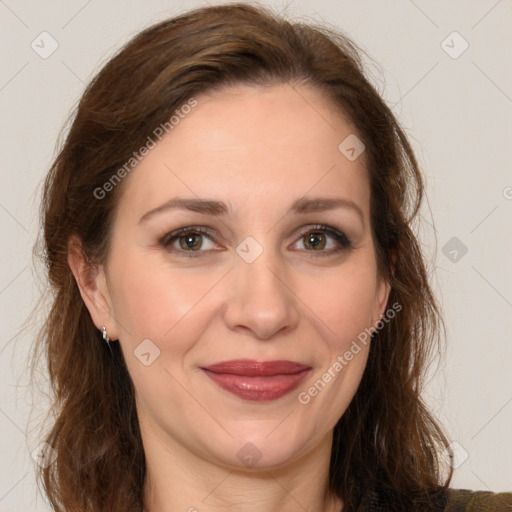 Joyful white adult female with long  brown hair and brown eyes