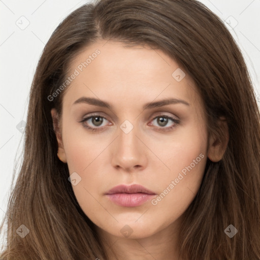 Neutral white young-adult female with long  brown hair and brown eyes