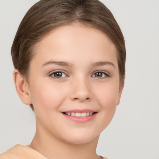 Joyful white child female with short  brown hair and brown eyes