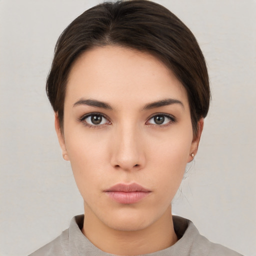 Neutral white young-adult female with short  brown hair and brown eyes