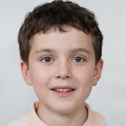 Joyful white child male with short  brown hair and brown eyes