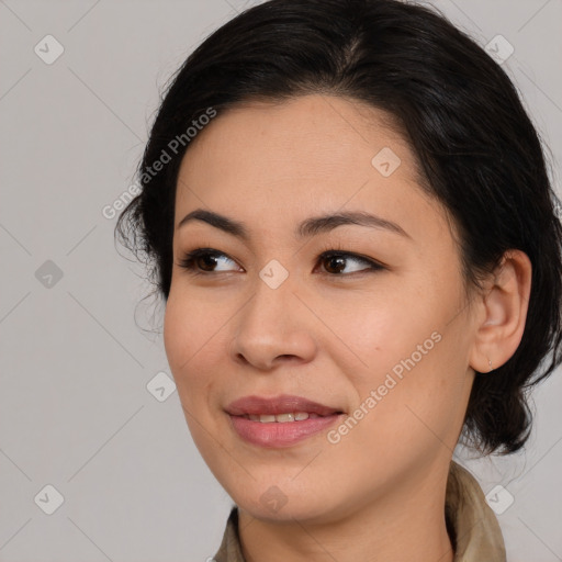 Joyful latino young-adult female with medium  brown hair and brown eyes