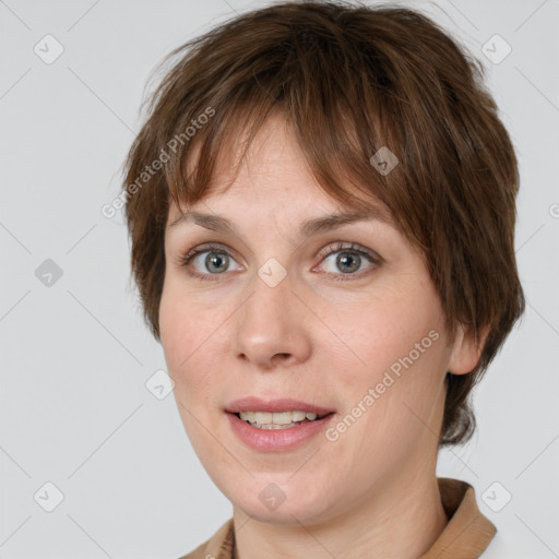 Joyful white adult female with medium  brown hair and grey eyes