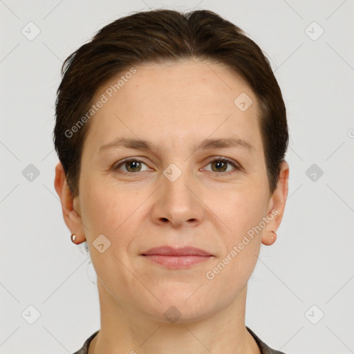 Joyful white adult female with short  brown hair and grey eyes