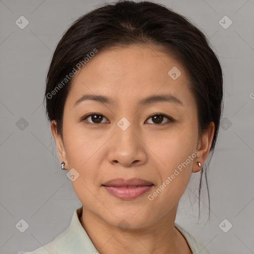 Joyful asian young-adult female with medium  brown hair and brown eyes