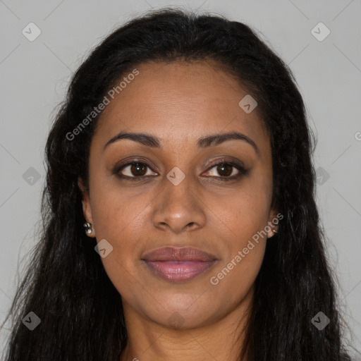 Joyful black young-adult female with long  brown hair and brown eyes