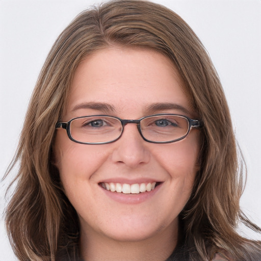 Joyful white young-adult female with long  brown hair and blue eyes