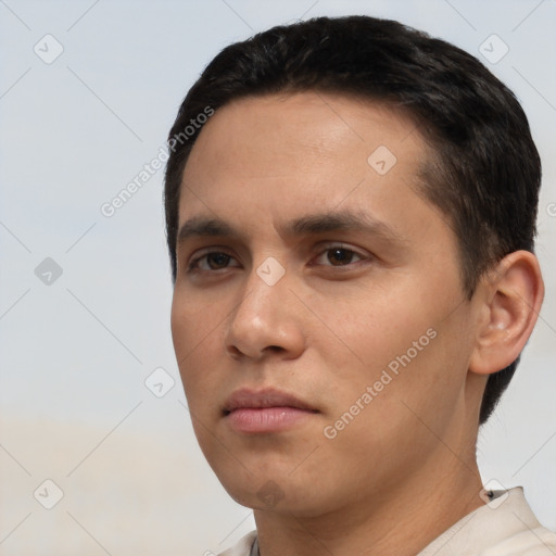 Neutral white young-adult male with short  black hair and brown eyes