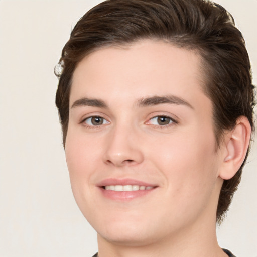 Joyful white young-adult male with medium  brown hair and brown eyes