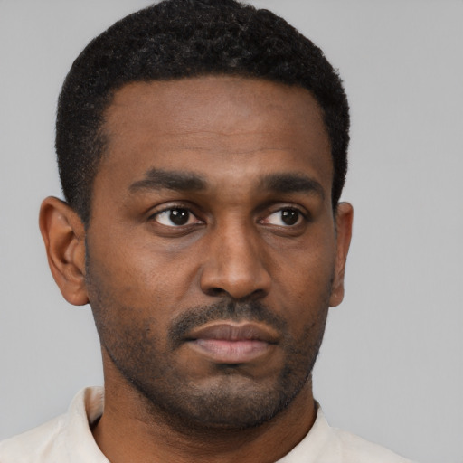 Neutral black young-adult male with short  black hair and brown eyes