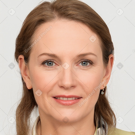 Joyful white adult female with medium  brown hair and grey eyes