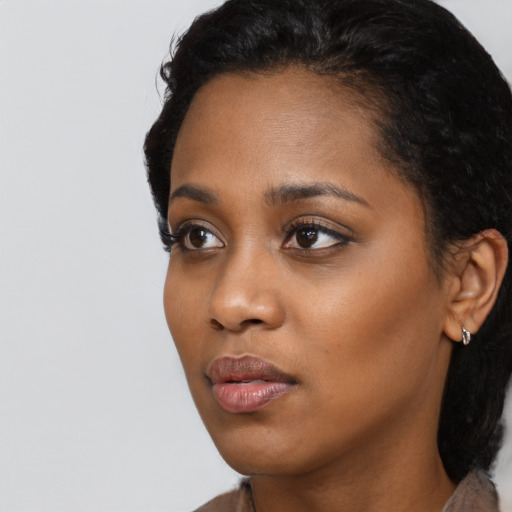 Neutral black young-adult female with short  black hair and brown eyes