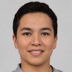 Joyful asian young-adult male with short  black hair and brown eyes