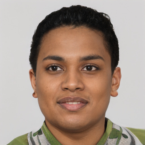 Joyful black young-adult female with short  black hair and brown eyes