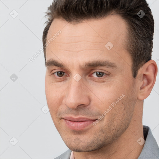 Joyful white adult male with short  brown hair and brown eyes