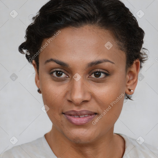 Joyful black young-adult female with short  brown hair and brown eyes