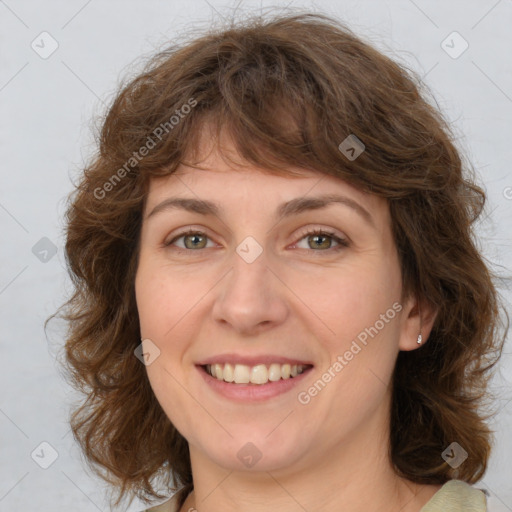 Joyful white young-adult female with medium  brown hair and green eyes