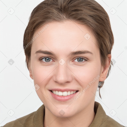 Joyful white young-adult female with medium  brown hair and grey eyes