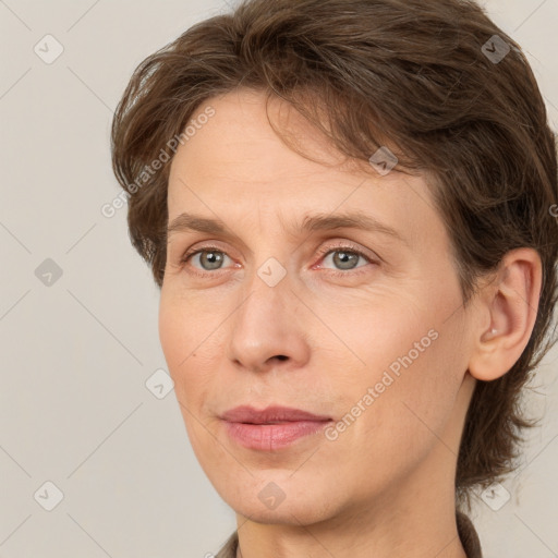 Joyful white adult female with medium  brown hair and grey eyes