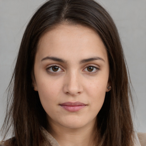 Neutral white young-adult female with long  brown hair and brown eyes