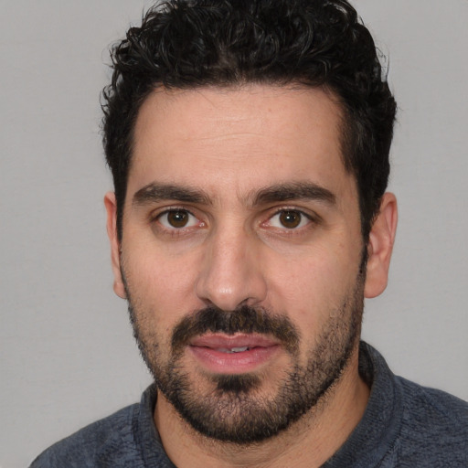 Neutral white young-adult male with short  black hair and brown eyes