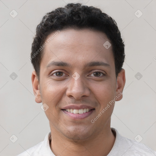 Joyful white young-adult male with short  black hair and brown eyes