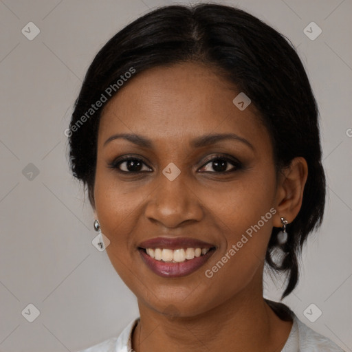 Joyful black young-adult female with medium  black hair and brown eyes