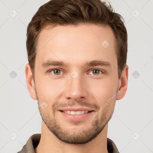 Joyful white young-adult male with short  brown hair and grey eyes