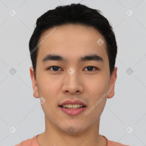 Joyful asian young-adult male with short  black hair and brown eyes