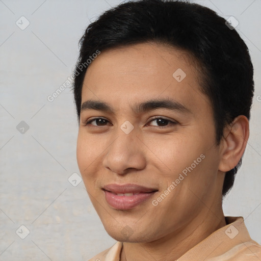 Joyful latino young-adult male with short  brown hair and brown eyes