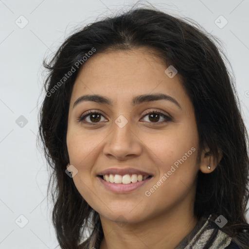 Joyful latino young-adult female with long  brown hair and brown eyes