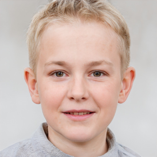 Joyful white child male with short  brown hair and blue eyes