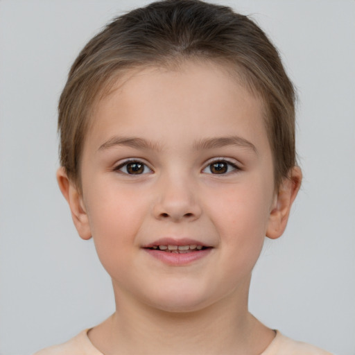 Joyful white child female with short  brown hair and brown eyes