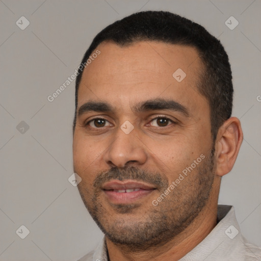 Joyful white young-adult male with short  black hair and brown eyes