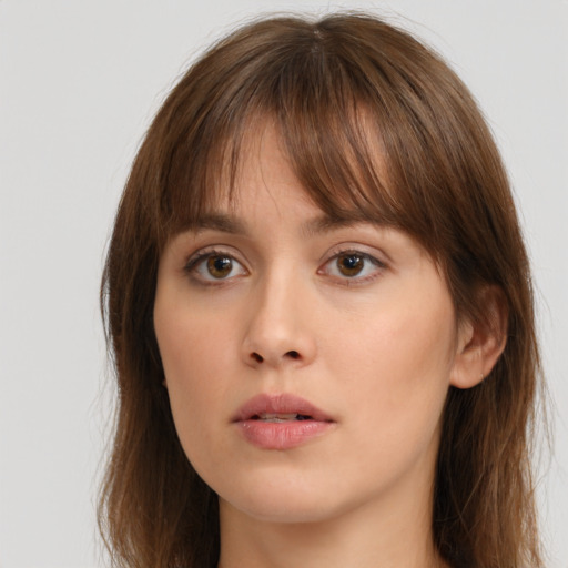 Neutral white young-adult female with long  brown hair and brown eyes