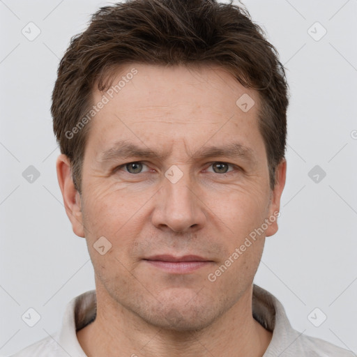 Neutral white adult male with short  brown hair and brown eyes