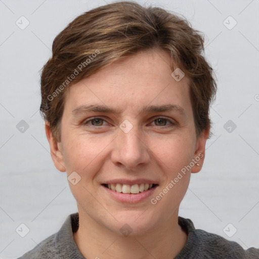 Joyful white young-adult female with short  brown hair and grey eyes