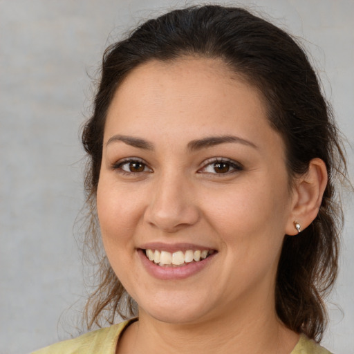 Joyful white young-adult female with medium  brown hair and brown eyes