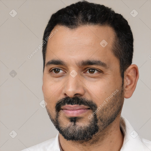 Joyful latino young-adult male with short  black hair and brown eyes