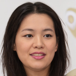 Joyful asian young-adult female with medium  brown hair and brown eyes