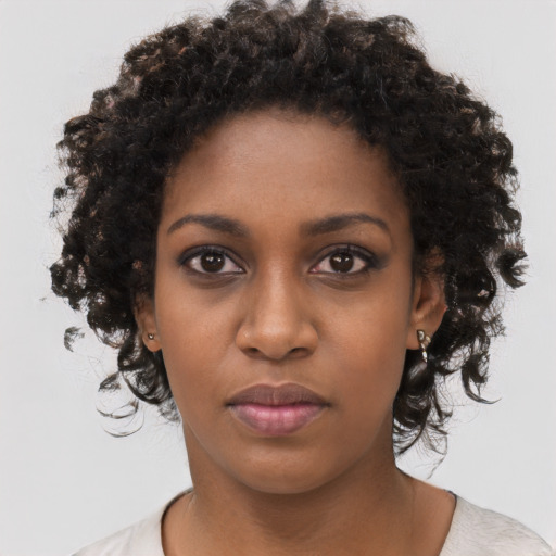 Neutral black young-adult female with medium  black hair and brown eyes