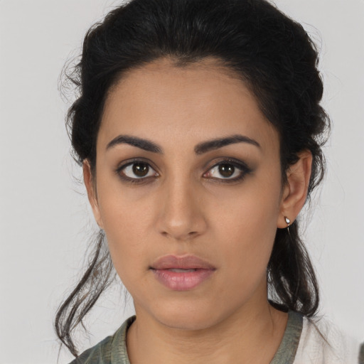 Neutral latino young-adult female with medium  black hair and brown eyes