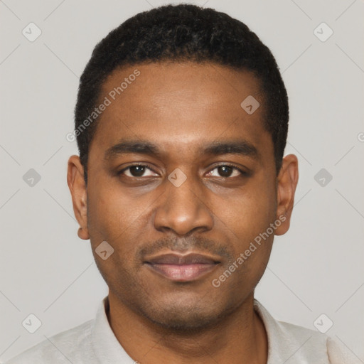 Joyful black young-adult male with short  black hair and brown eyes