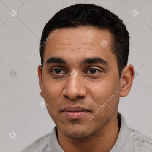 Neutral latino young-adult male with short  black hair and brown eyes