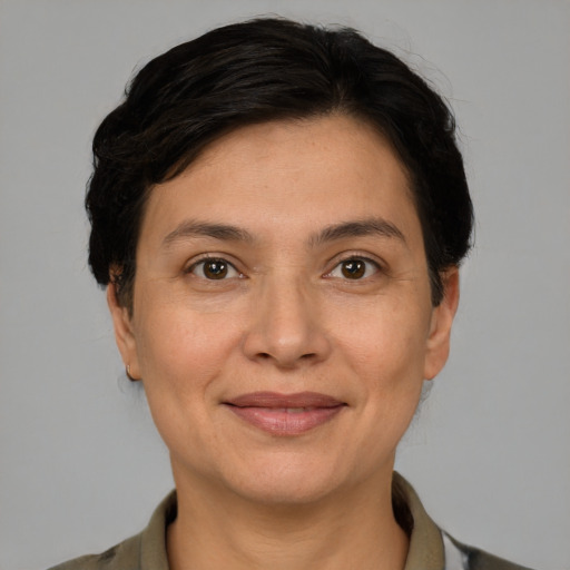 Joyful white adult female with medium  brown hair and grey eyes